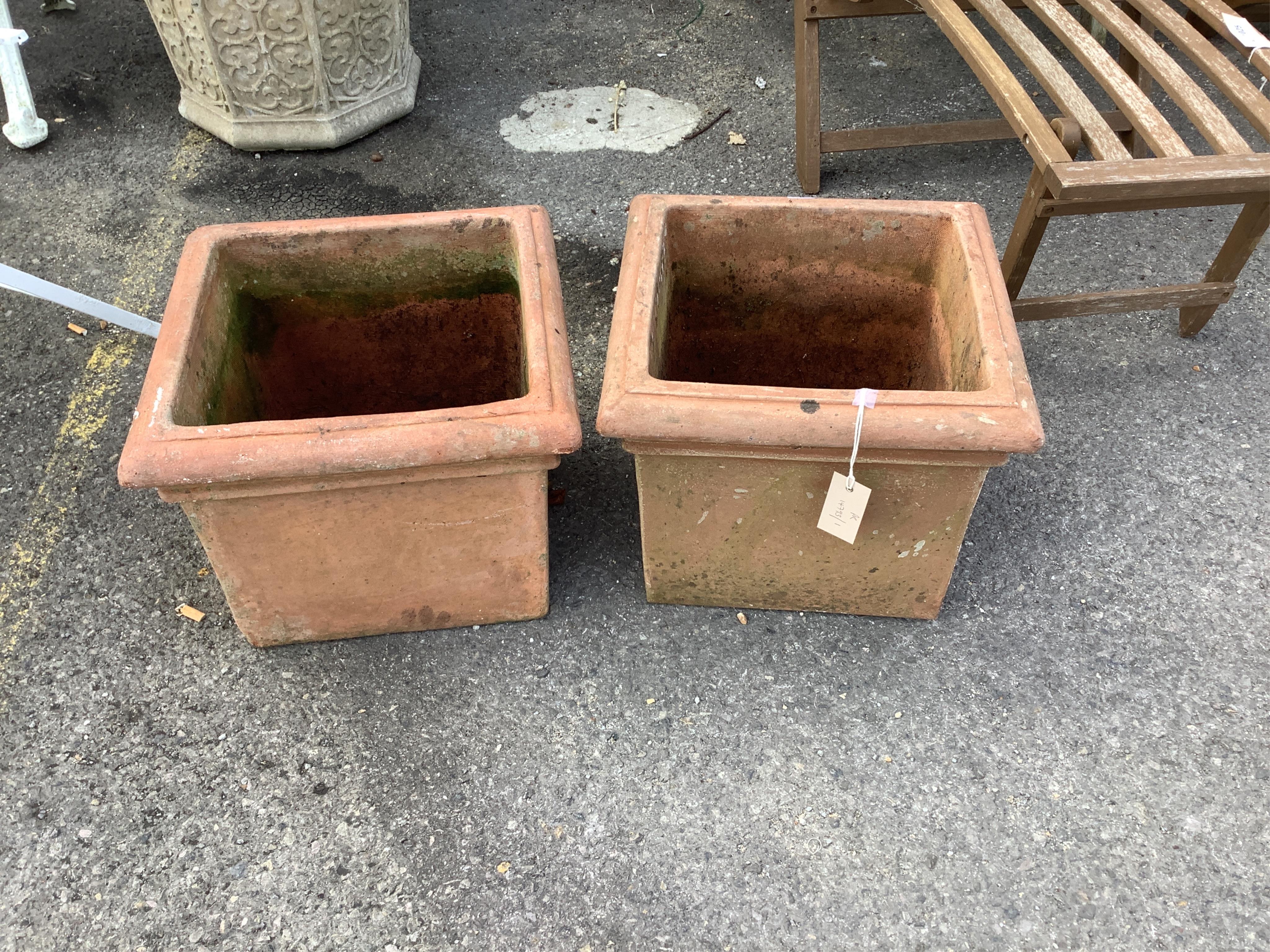 A pair of square terracotta garden planters, width 36cm, height 29cm. Condition - good